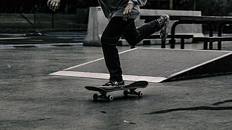 Skateboarder performing trick at skate park