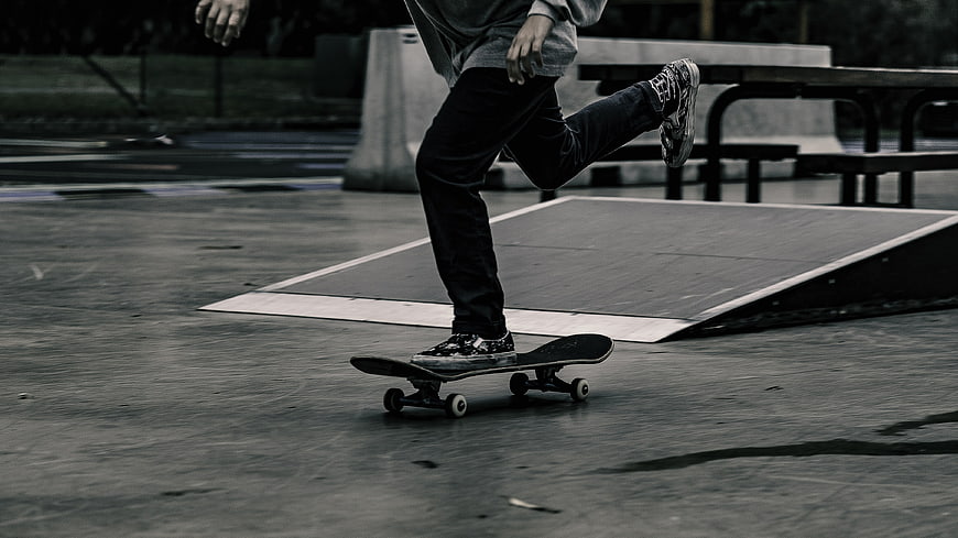 Skateboarder performing trick at skate park