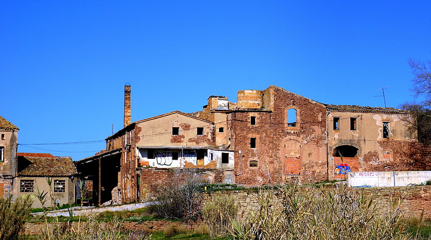 Abandoned brick factory ruins under blue sky
