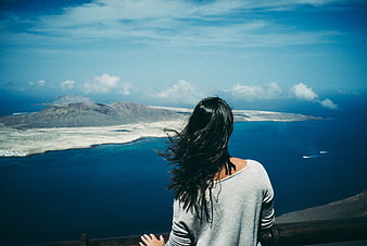 Woman Looking at Santorini Caldera View