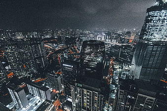 Aerial Night View of Modern City Skyscrapers and Urban Lights