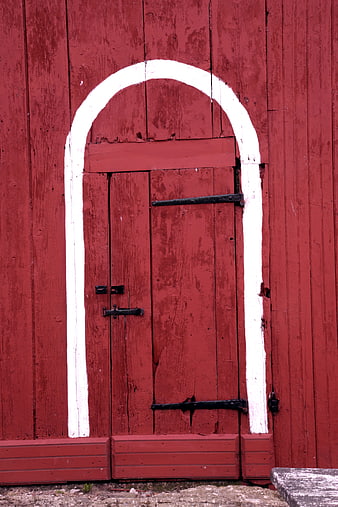 Red Wooden Barn Door with White Arch Detail