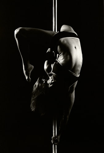 Black and White Pole Dancer in Inverted Pose
