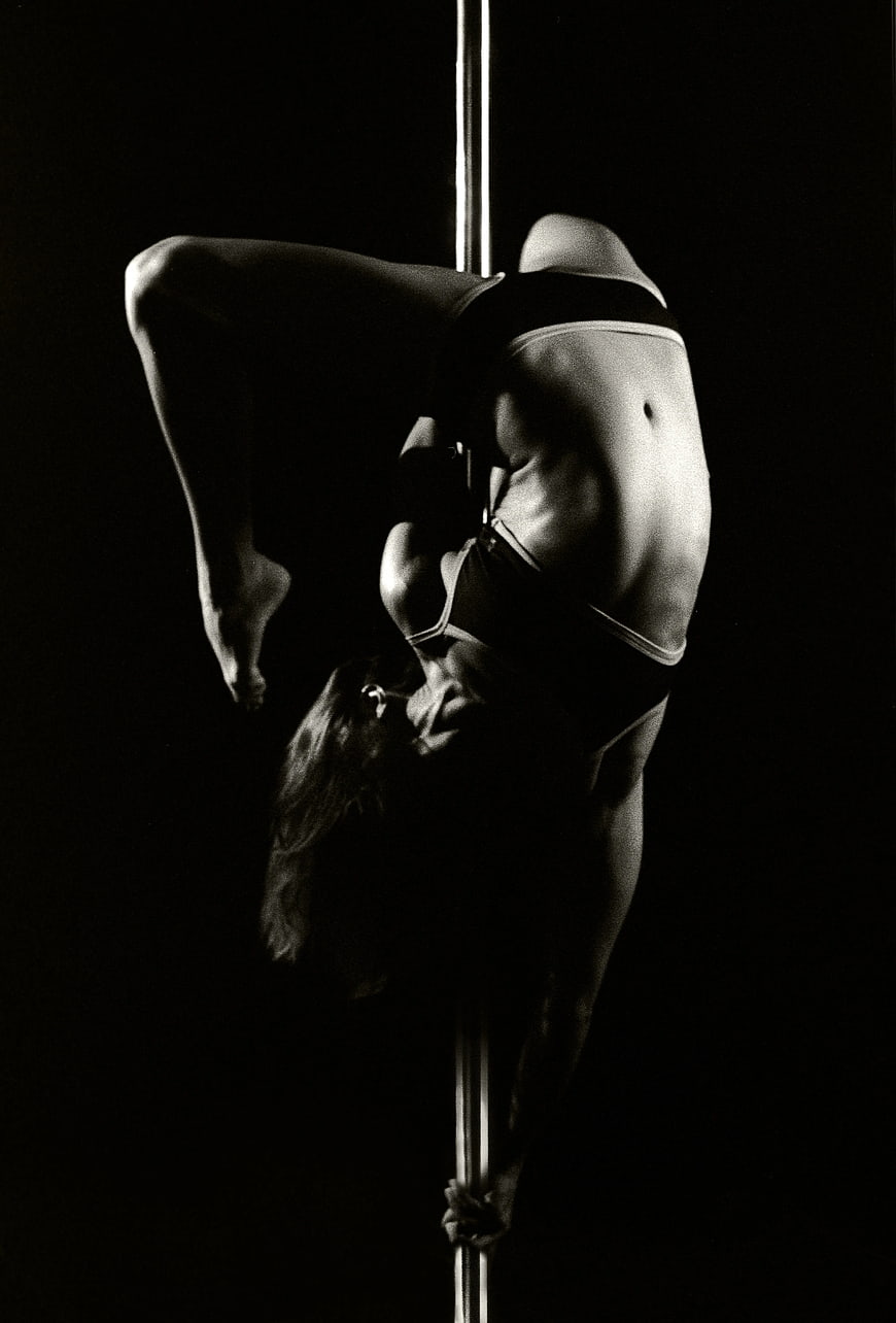 Black and White Pole Dancer in Inverted Pose