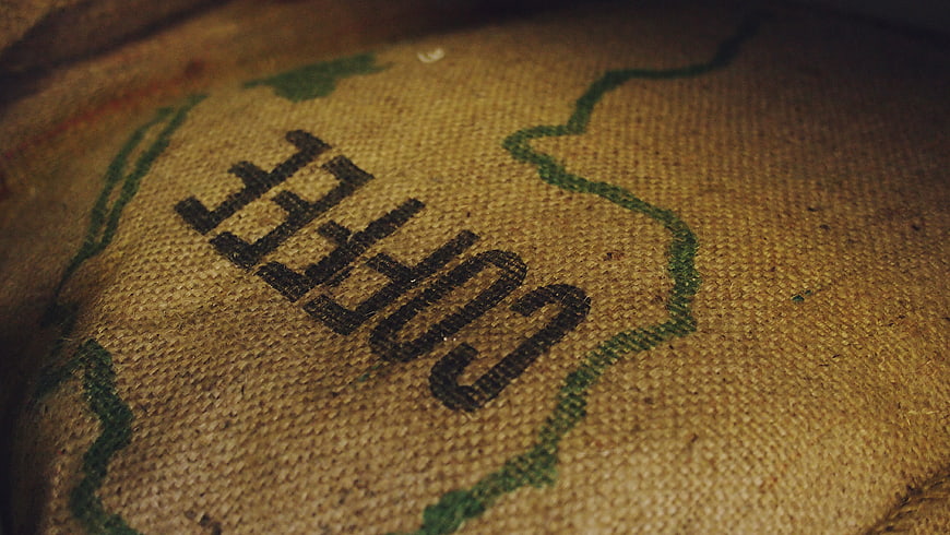 Close-up of Coffee Text on Burlap Sack Texture