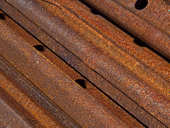 Close-up texture of rusty corrugated metal sheets