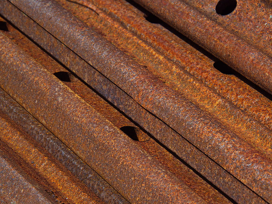 Close-up texture of rusty corrugated metal sheets