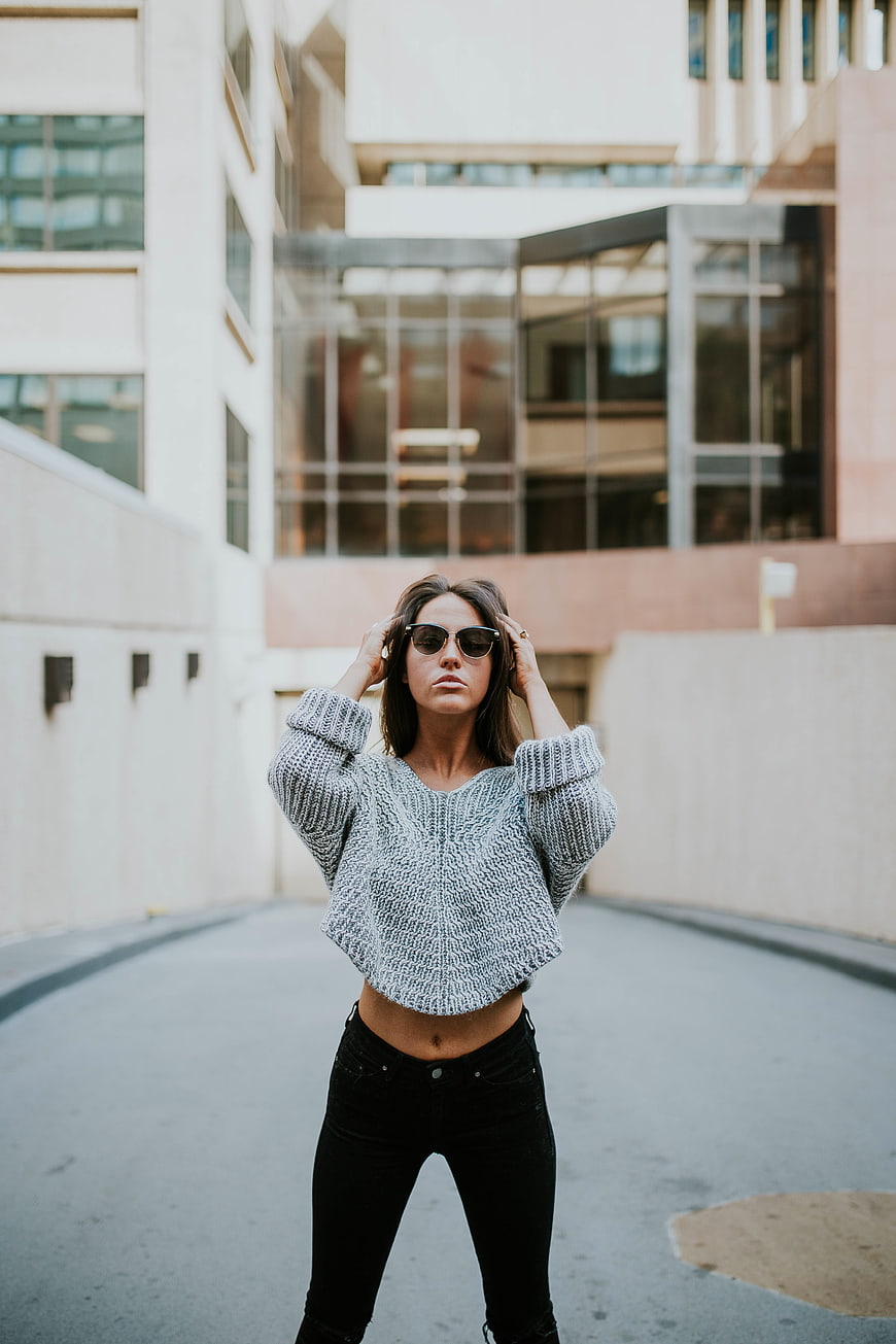 Stylish Woman in Sunglasses and Knit Sweater Urban Street