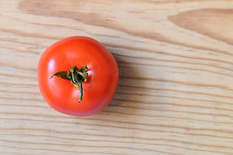 Fresh Red Tomato on Wooden Table Top View