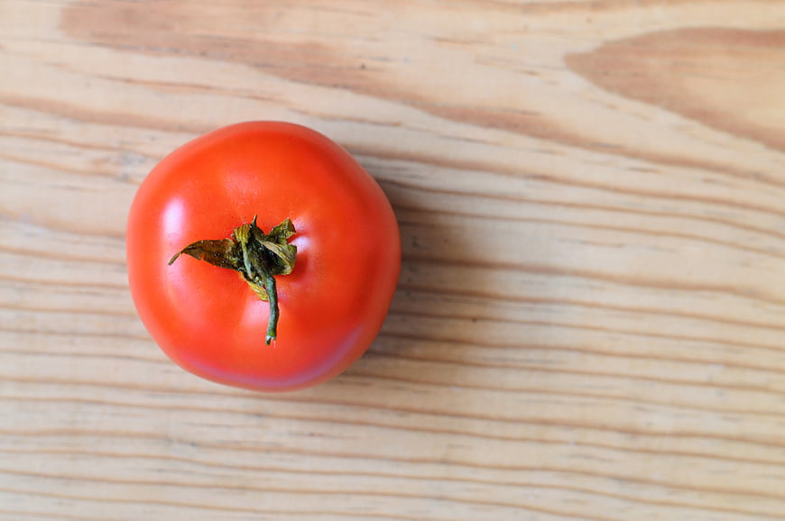 Fresh Red Tomato on Wooden Table Top View