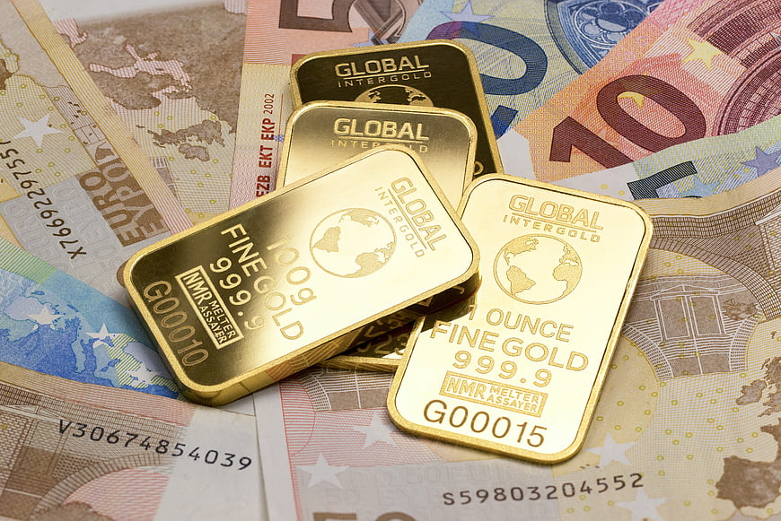 Gold bars on Euro banknotes for investment