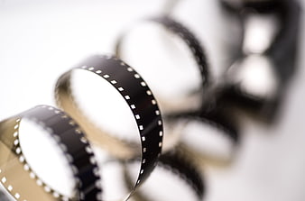 Close-up of vintage film strip on white background