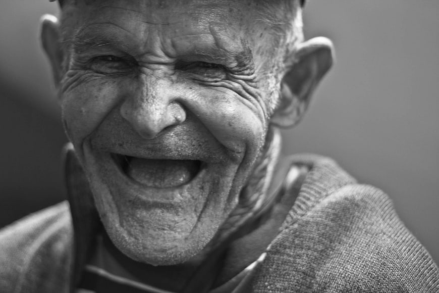 Close-up Black and White Portrait of Laughing Senior Man