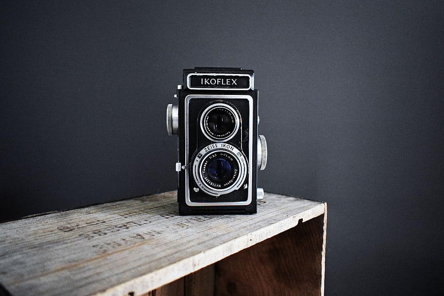 Vintage Ikoflex Camera on Wooden Shelf