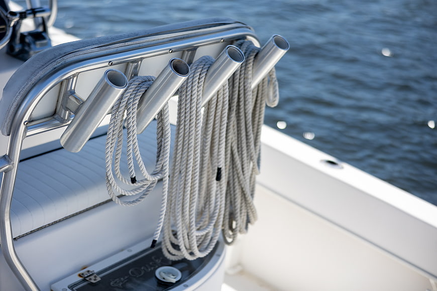 Close-up of coiled ropes on yacht cleats