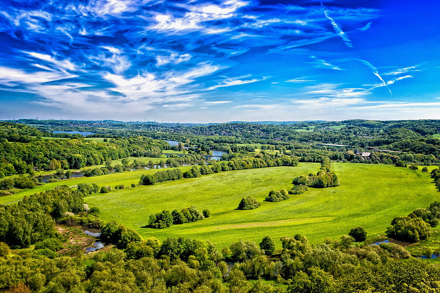 Aerial View of Green Meadows and River Valley in Germany