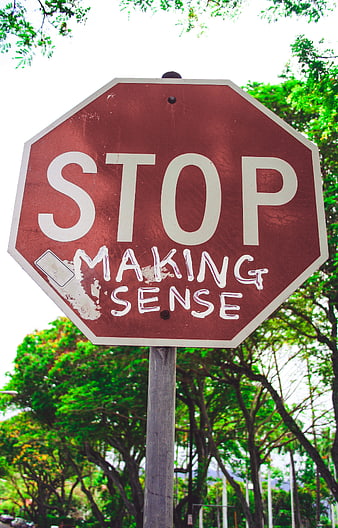 Stop Making Sense Graffiti on Red Traffic Sign
