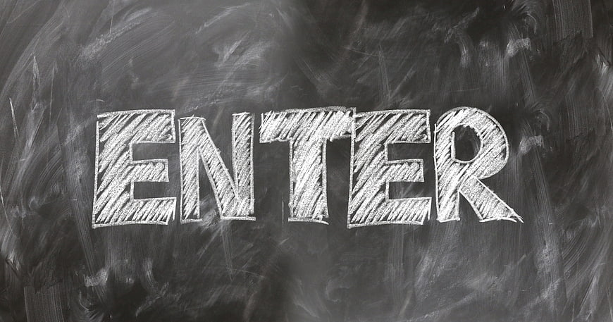 Handwritten Enter Text On Dark Chalkboard Background