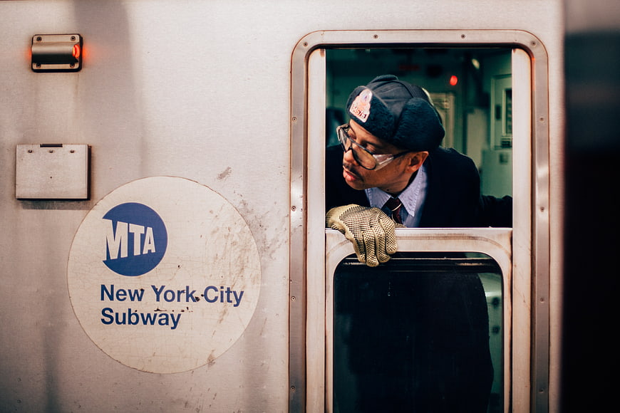 MTA Subway Conductor Leaning Out of Train Window