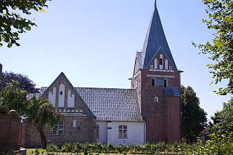 Historic Brick Church with Tall Spire in Denmark