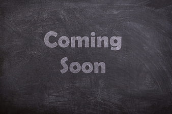 Coming Soon Text Written in Chalk on Blackboard