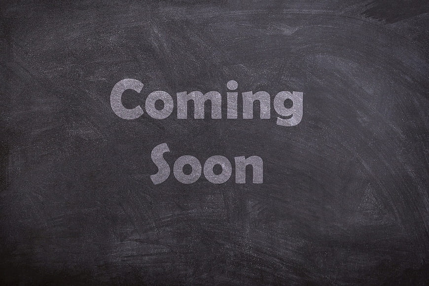 Coming Soon Text Written in Chalk on Blackboard