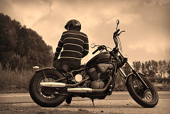 Biker on Custom Motorcycle on Rural Road