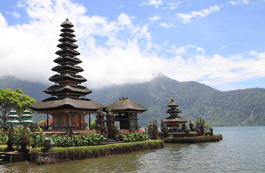 Traditional Balinese Temple on Lake with Mountain Background