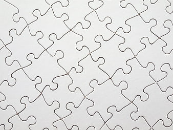 White jigsaw puzzle pieces background pattern