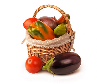 Wicker Basket Filled With Fresh Organic Vegetables On White Background