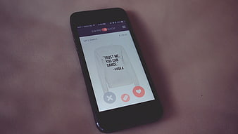 Smartphone displaying online shopping app interface on pink background