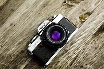Vintage Minolta XG-S Film Camera on Wooden Background