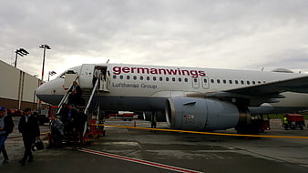 Passengers boarding Germanwings airplane on airport tarmac