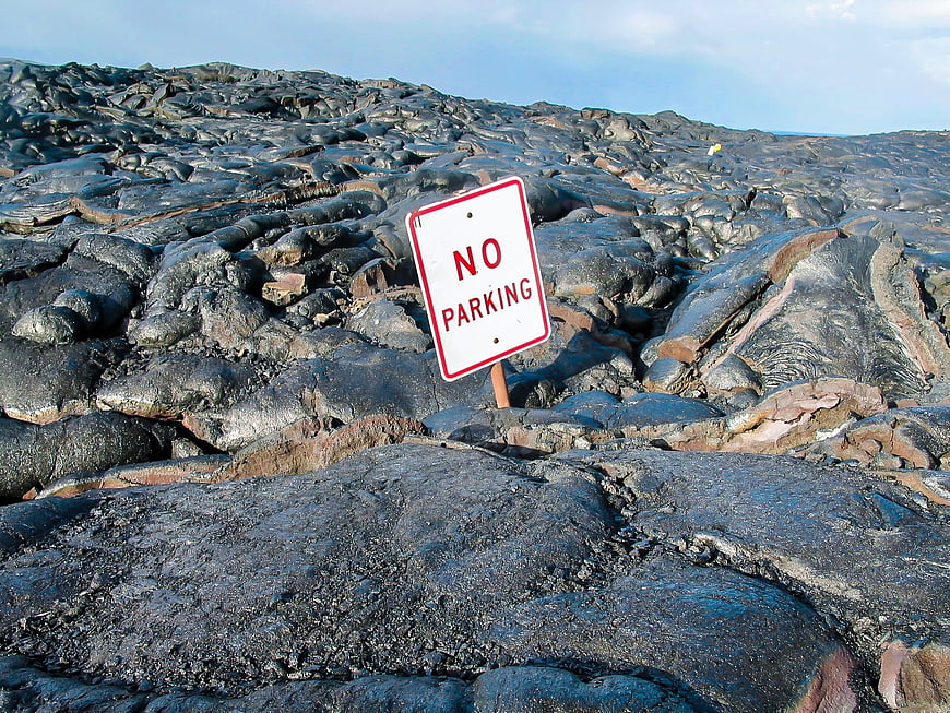No Parking Sign on Rugged Black Lava Rock Field