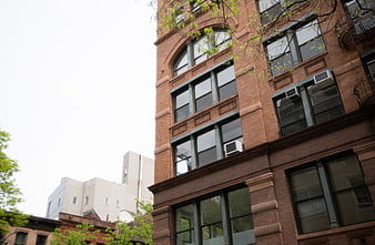 Low Angle View of Red Brick Apartment Building with Windows