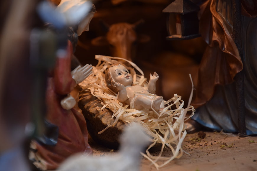 Close-up of Baby Jesus Figurine in Nativity Scene