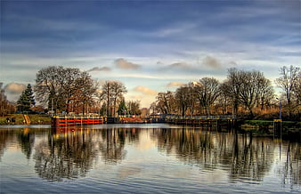 Scenic Canal Lock in Fürstenwalde, Germany, with Autumn Trees and Water Reflections