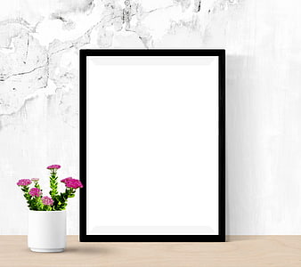 Black Picture Frame Mockup On Wooden Desk With Pink Flowers
