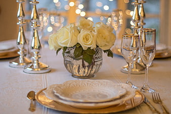 Elegant Wedding Table Setting with White Roses and Silver Candelabras