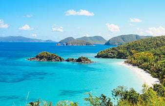 Aerial View of Tropical Island Beach with Turquoise Water and Lush Green Hills