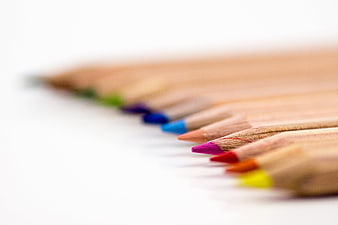 Close-up of colorful wooden pencils on white background