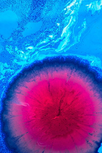 Abstract fluid art with vibrant pink and blue ink swirls