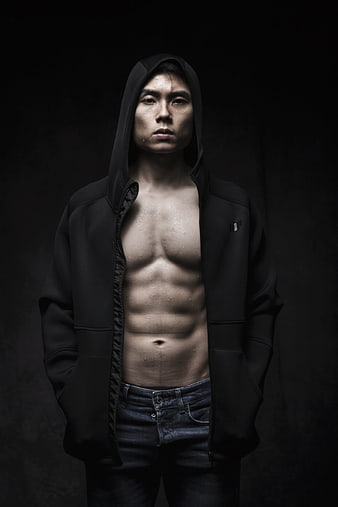 Moody Portrait of Asian Man in Black Hoodie with Exposed Abs