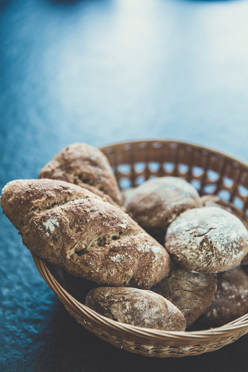 Rustic Whole Wheat Bread Loaves in Wicker Basket