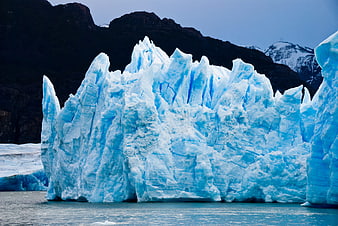 Majestic Blue Glacier in Patagonia with Dark Mountains