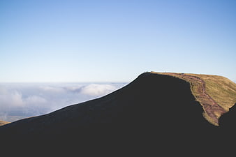 Mountain Peak Above Sea of Clouds with Hikers