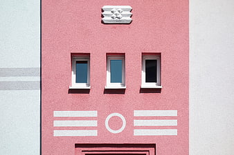 Pink Art Deco Building Facade with Geometric Details