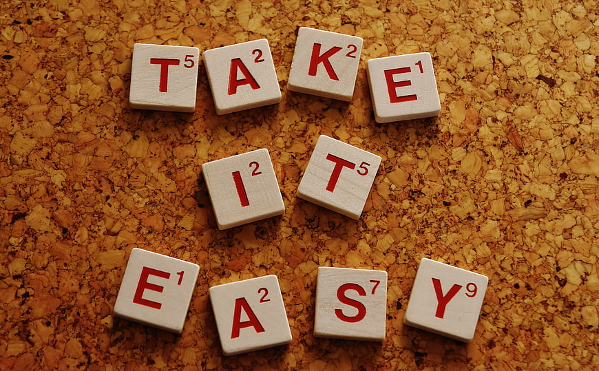 Scrabble Tiles Spelling Take It Easy on Cork Board