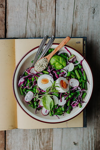 Top view of healthy green bean salad with eggs and hemp seeds
