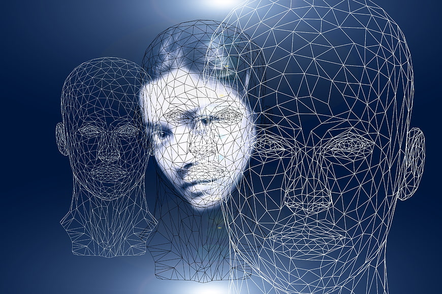 Abstract wireframe human faces representing psychology and identity